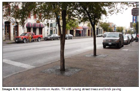 Image 4.4: Bulb out in Downtown Austin, TX with young street trees and brick paving